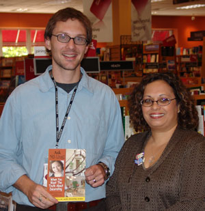 Mi-Ling stands with Josh Robbins, manager of Borders Books in Lawrence, KS